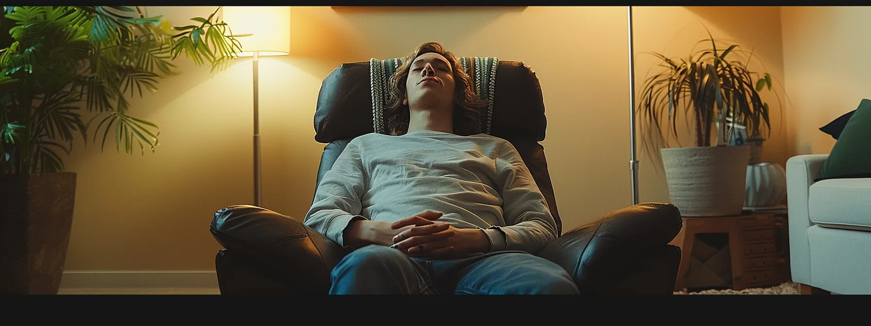 a person sitting in a therapist's office, eyes closed, surrounded by a calming, therapeutic environment as they undergo emdr therapy for trauma recovery.