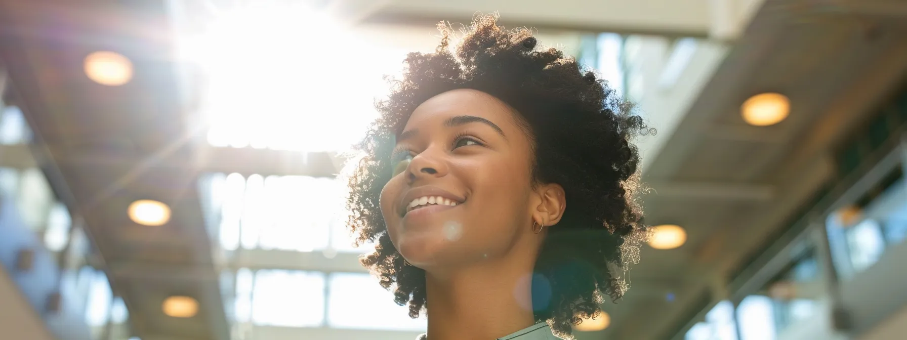 a person standing tall and smiling, radiating a newfound sense of freedom and happiness after emdr therapy.