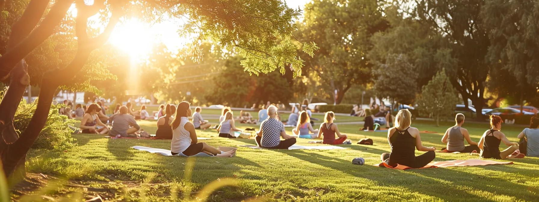 a serene and vibrant outdoor gathering showcases diverse individuals engaging in healthy activities, reflecting the harmonious interplay between mental well-being and physical fitness under soft, golden sunlight.